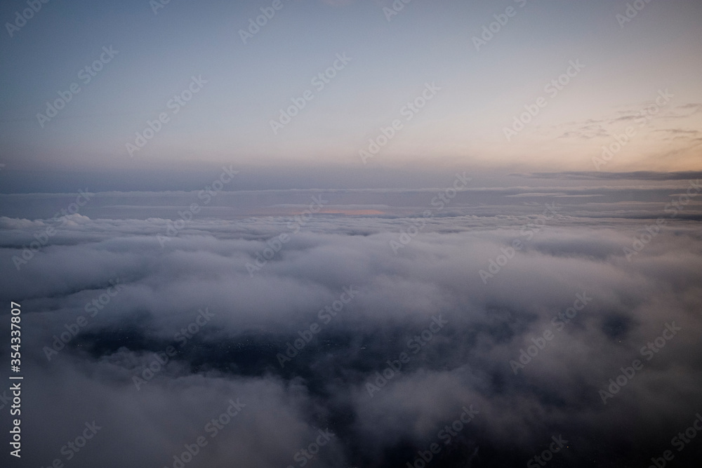 Clouds seen from a plane at dawn Clouds seen from a plane at dawn