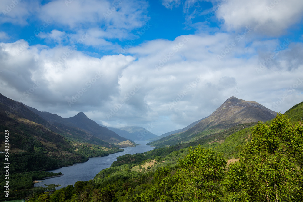 a view over loch leven from the west highland way near kinlochleven and fort william in the argyll region of the highlands of scotland during a warm spring day showing green forest and hillsides a view over loch leven from the west highland way near kinlochleven and fort william in the argyll region of the highlands of scotland during a warm spring day showing green forest and hillsides