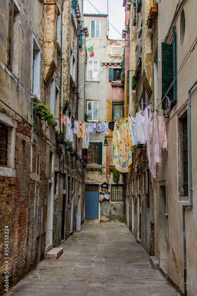 Clothes hanging on a clothesline in a narrow street in Venice, Italy