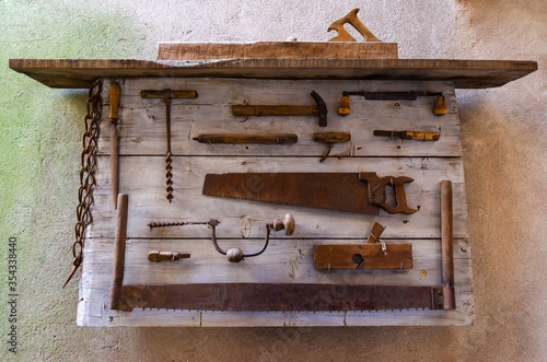 Old work tools on a board
