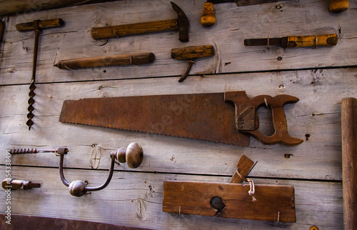 Old work tools on a board