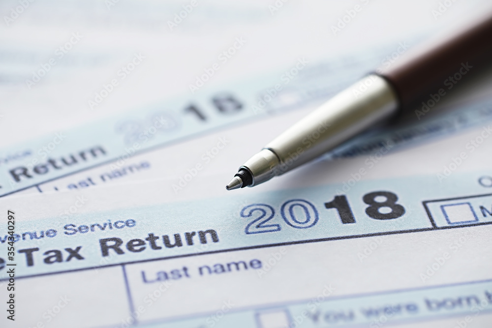 Annual tax reporting. Tax form on the table. Financial statements for signature. Annual tax reporting. Tax form on the table. Financial statements for signature.