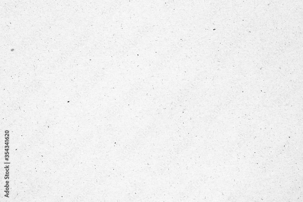 Obraz premium White paper or cardboard texture with black spot background.
