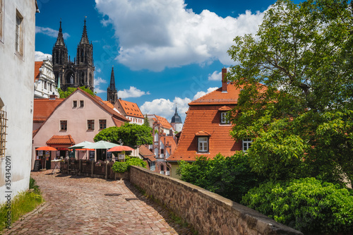 Meissen fable like old town with Albrechtsburg Castle. town Medieval buildings with orange tiled roofs. Dresden, Saxony, Germany. Sunny Day in Spring season © Igor Tichonow