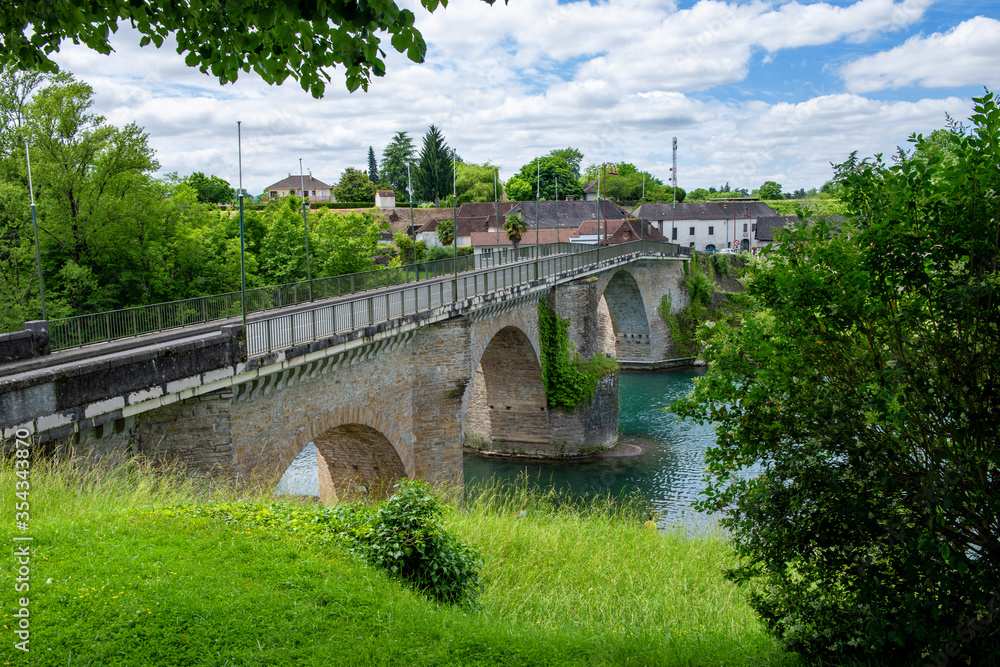 Ancient bridge over the river Gave d`Oloron at town of Navarrenx, France.