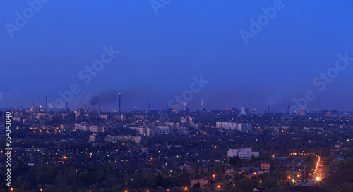 Evening city in eastern europe, industrial area in the background