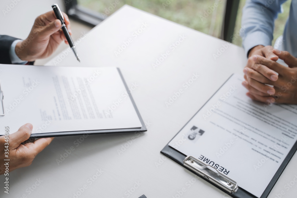 Employment concept, Employer recruiter with candidate with resume in job interview. Employment concept, Employer recruiter with candidate with resume in job interview.