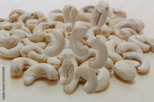 Cashew nuts falling on the wood floor