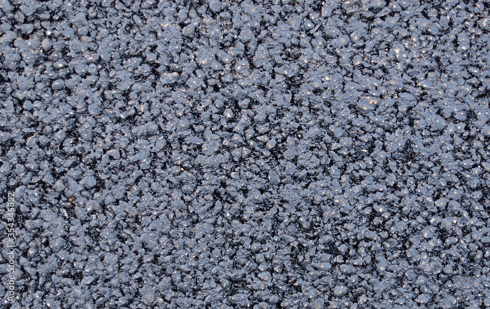 Texture of fresh and new black asphalt. Background of new asphalt. Texture of fresh and new black asphalt. Background of new asphalt.