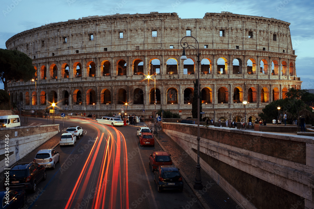 Illuminated Coliseum at dusk, Rome, Italy