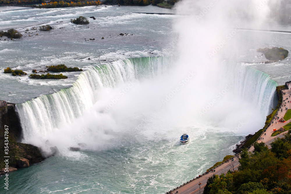 View of the Horsehoe Falls at Niagara Falls enveloped in mist. View of the Horsehoe Falls at Niagara Falls enveloped in mist.