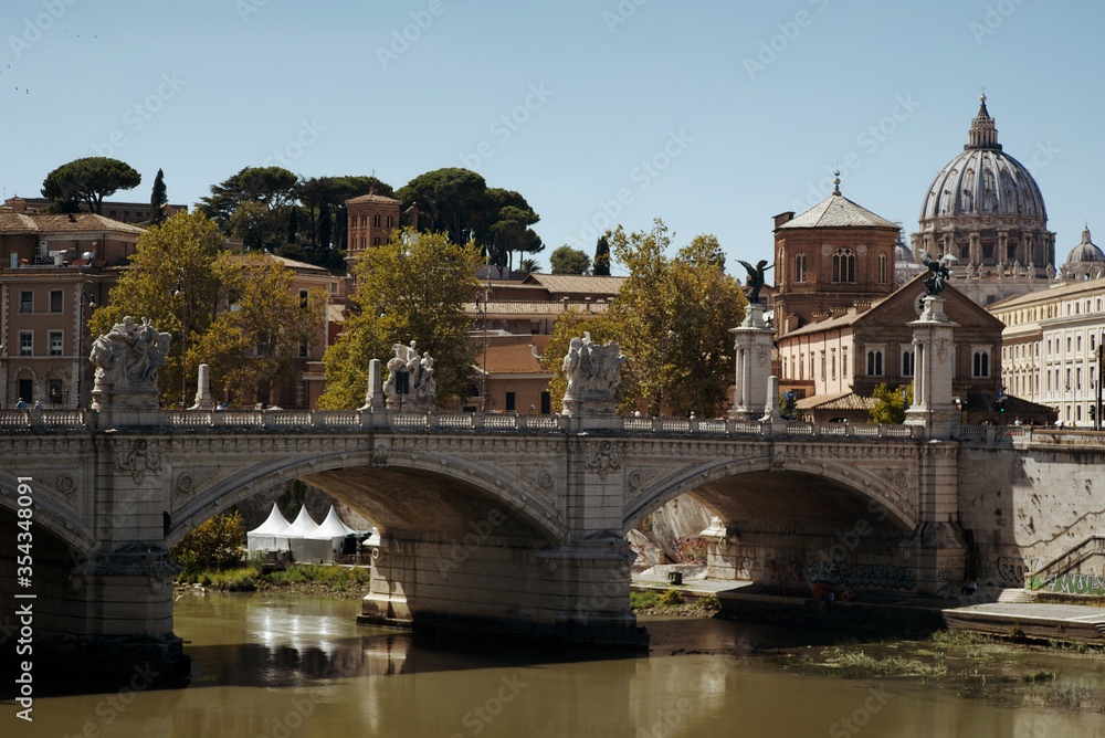 Rome skyline at day with Tiber river and St. Peter's Basilica. Rome skyline at day with Tiber river and St. Peter's Basilica.