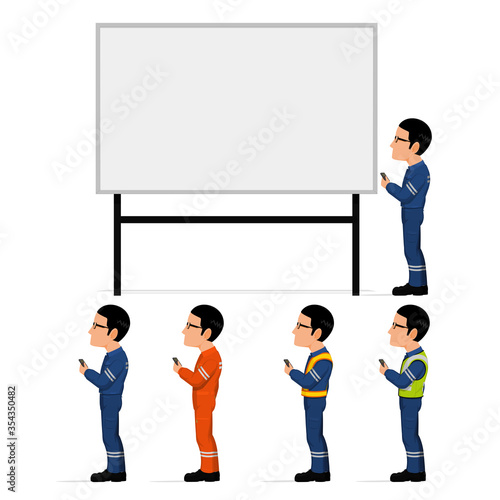 An industrial worker is pointing to something on the white board