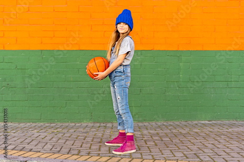 Young girl with basketball photo