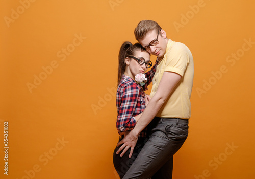 funny students in love on a yellow background