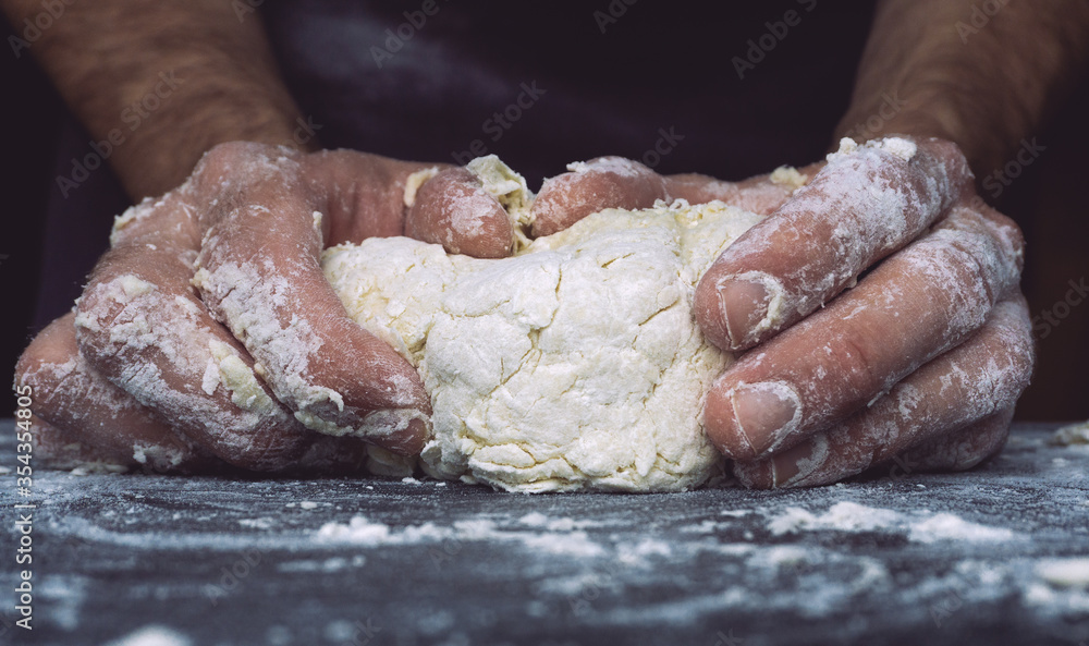 Dough pizza background. Hands prepare dough for pizza or bread on the kitchen table. Dough pizza background. Hands prepare dough for pizza or bread on the kitchen table.