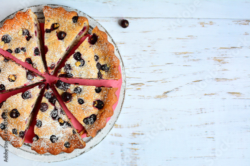 Appetizing pie with black currants and blueberries. Homemade baking