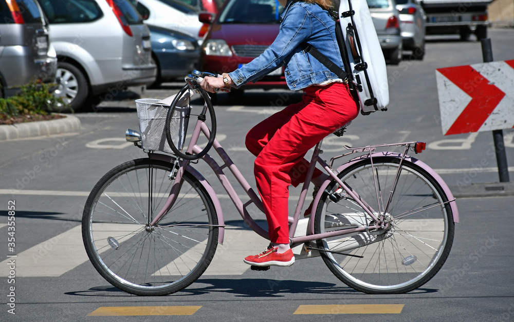 Woman with bicycle on the city street Woman with bicycle on the city street