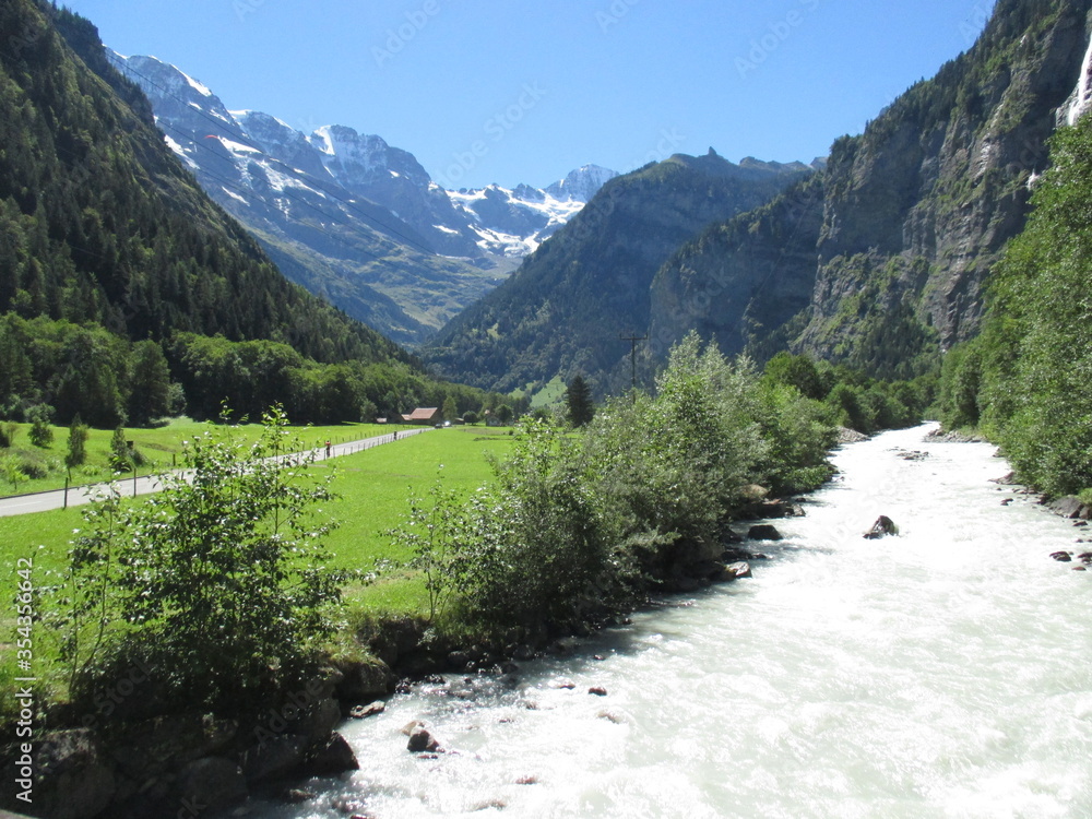 Lauterbrunnen Valley, rushing river and Swiss Alps, Switzerland