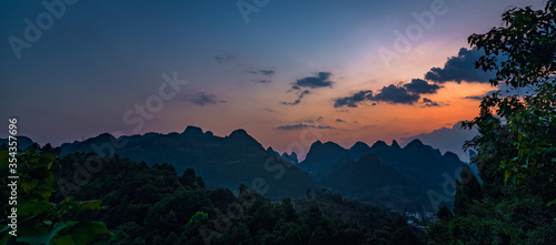 Panorama of Yangshuo landscape from Xianggong Hill viewpoint at dusk