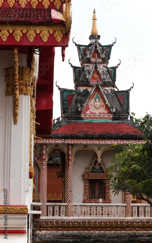 View onto a temple building with various decorative roof top levels in Siamese Lao PDR, Southeast Asia