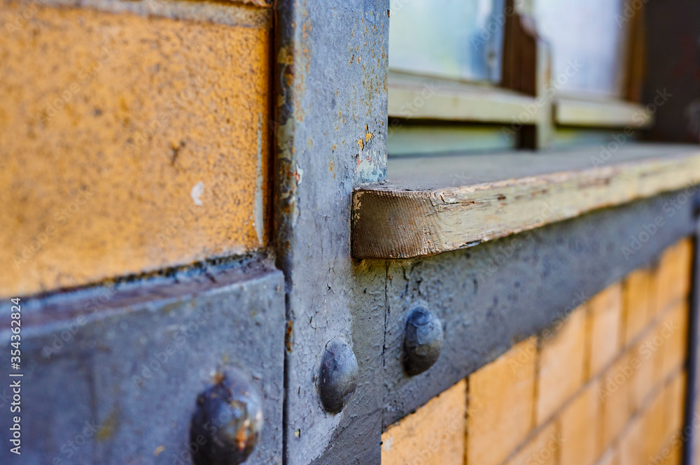 Details of a historic station building in Berlin, Germnany. You can see a weathered wooden window sill and the frame in a brick wall. Details of a historic station building in Berlin, Germnany. You can see a weathered wooden window sill and the frame in a brick wall.