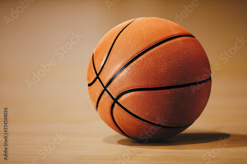 Basketball on basketball parquet floor. Close-up image. Basketball Sports Background