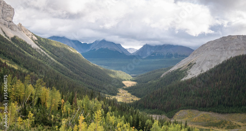 View on alpine valley with forest and mountains, shot on Mount Smutwood trail in Kananaskis, Alberta, Canada