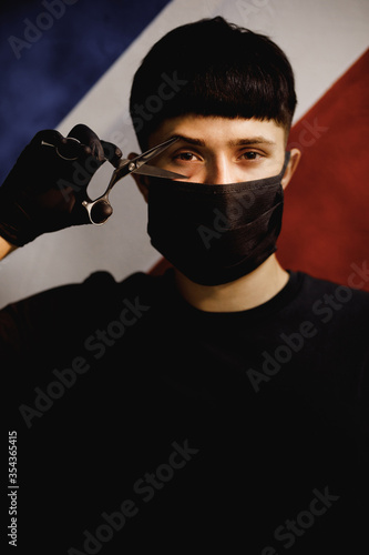 young barbershop with a pair of scissors on the barbershop flag