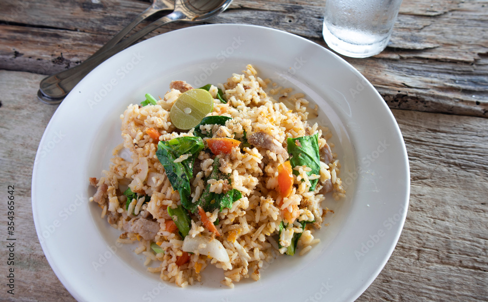 Pork fried rice on a white plate Pork fried rice on a white plate