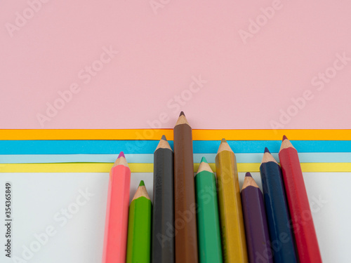 Colored pencils and paper, drawing and art.