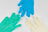Medical masks and surgical gloves on a white background close-up