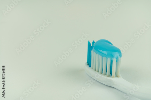 Old toothbrush on a white background