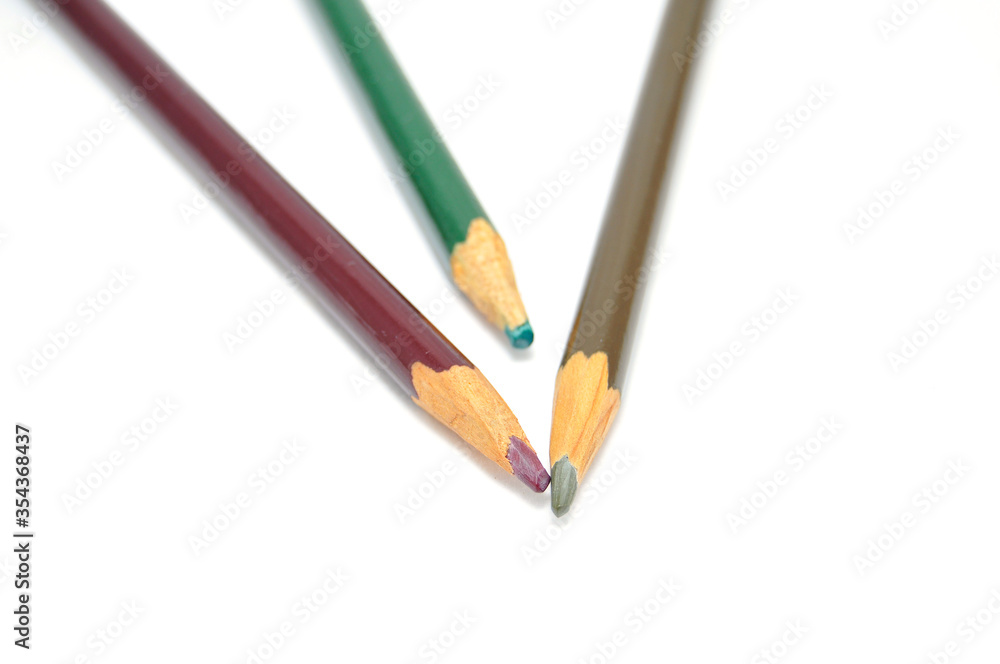 Colored pencils on a white background close up Colored pencils on a white background close up