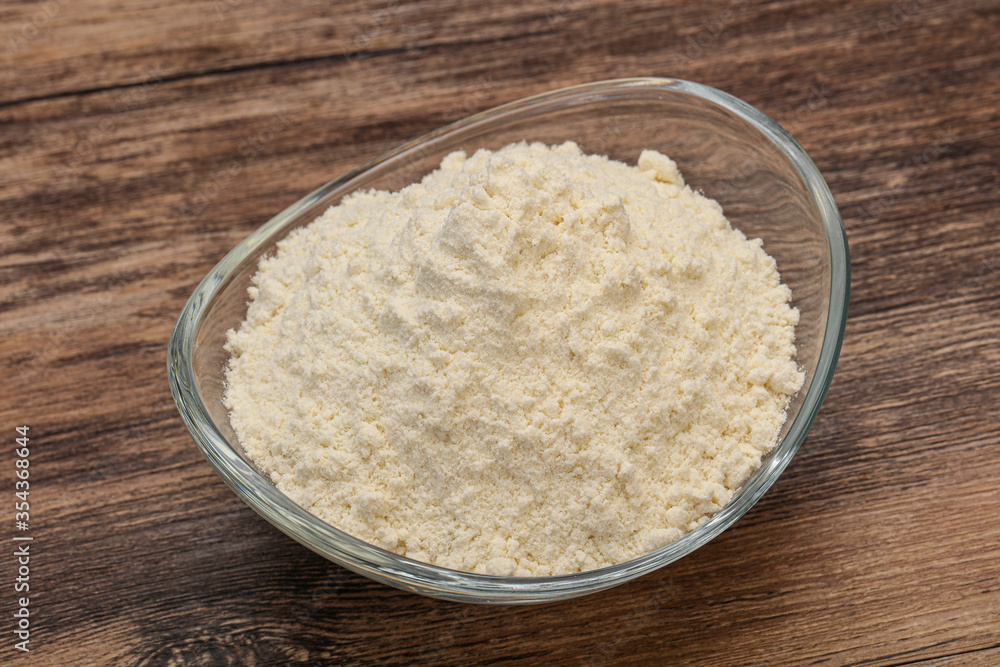 Wheat flour heap in the bowl Wheat flour heap in the bowl