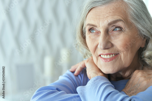 Portrait of beautiful senior woman posing at home