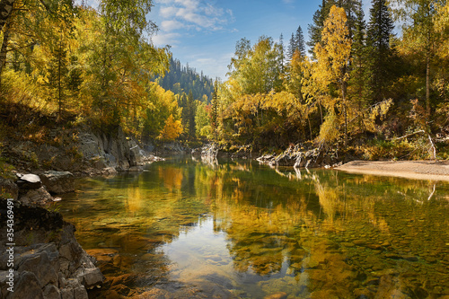 Kumir River flowing through the autumn Altai Mountains.