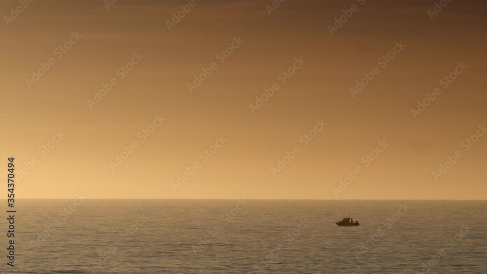 Fishing boat on sea water at sunrise. Seascape Fishing boat on sea water at sunrise. Seascape