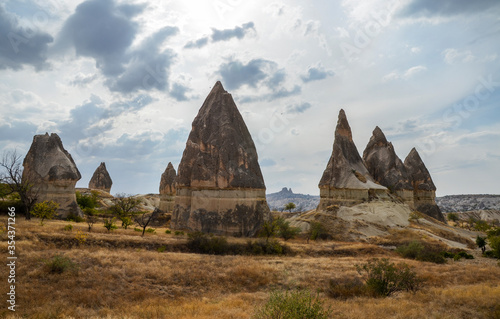 Beautiful landscape of ancient geological formation called fairy chimneys in Cappadocia valley, Turkey