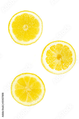 Isolated yellow lemon citrus slices on white background