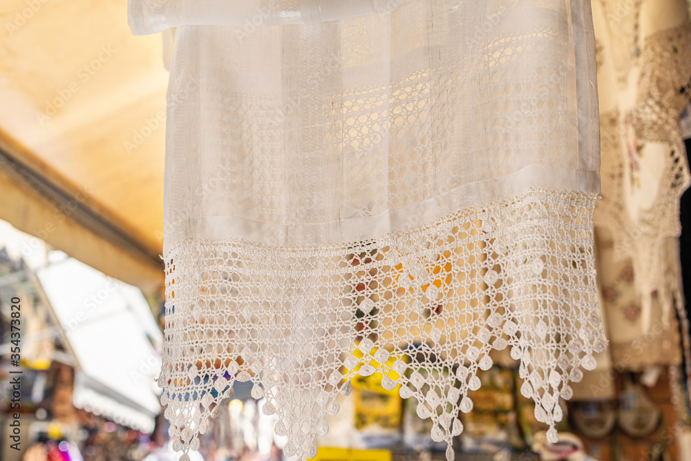 Embroidered traditional tablecloth at the tourist souvenir market of Crete, Greece