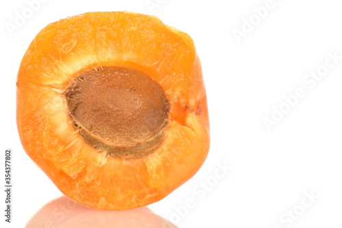 Bright yellow fresh, organic, ripe apricots, close-up, on a white background.