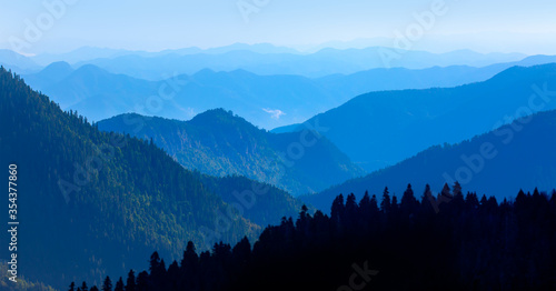 Amazing landscape with Cascade blue mountains at twilight blue hour  © muratart