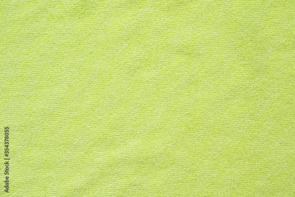 Fototapeta premium Green towel fabric texture surface close up background