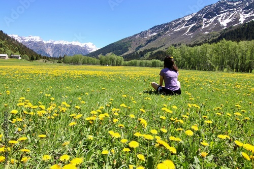 Meadow of dandelion mountain switzerland with girl Campra Olivone Ticino