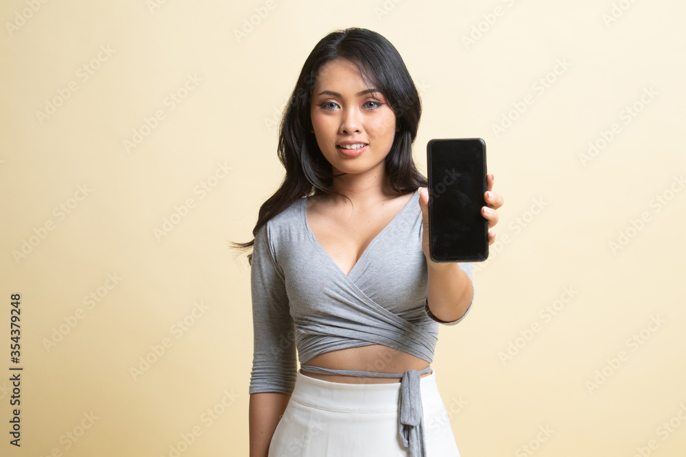 Young Asian woman with mobile phone. Young Asian woman with mobile phone.