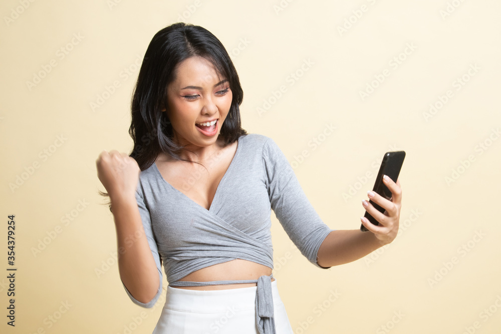 Successful young Asian woman with mobile phone. Successful young Asian woman with mobile phone.