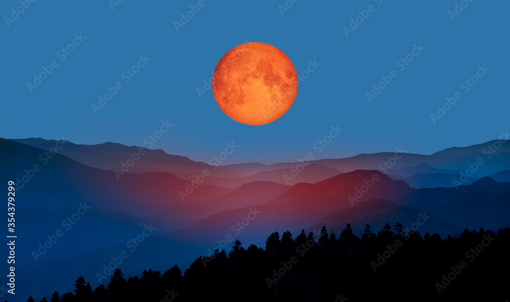 Bloody moon of Total Lunar Eclipse with blue mountains 