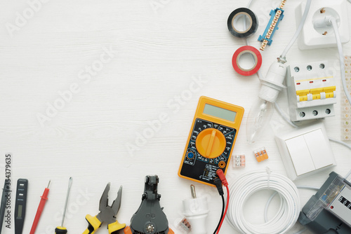 Electric equipment and accessories concept flat lay background with copy space. Electrical works. photo