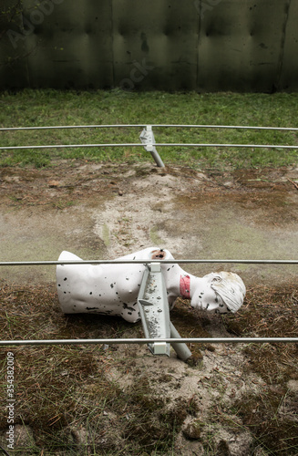 Rifle range with manequins covered with bullet holes photo